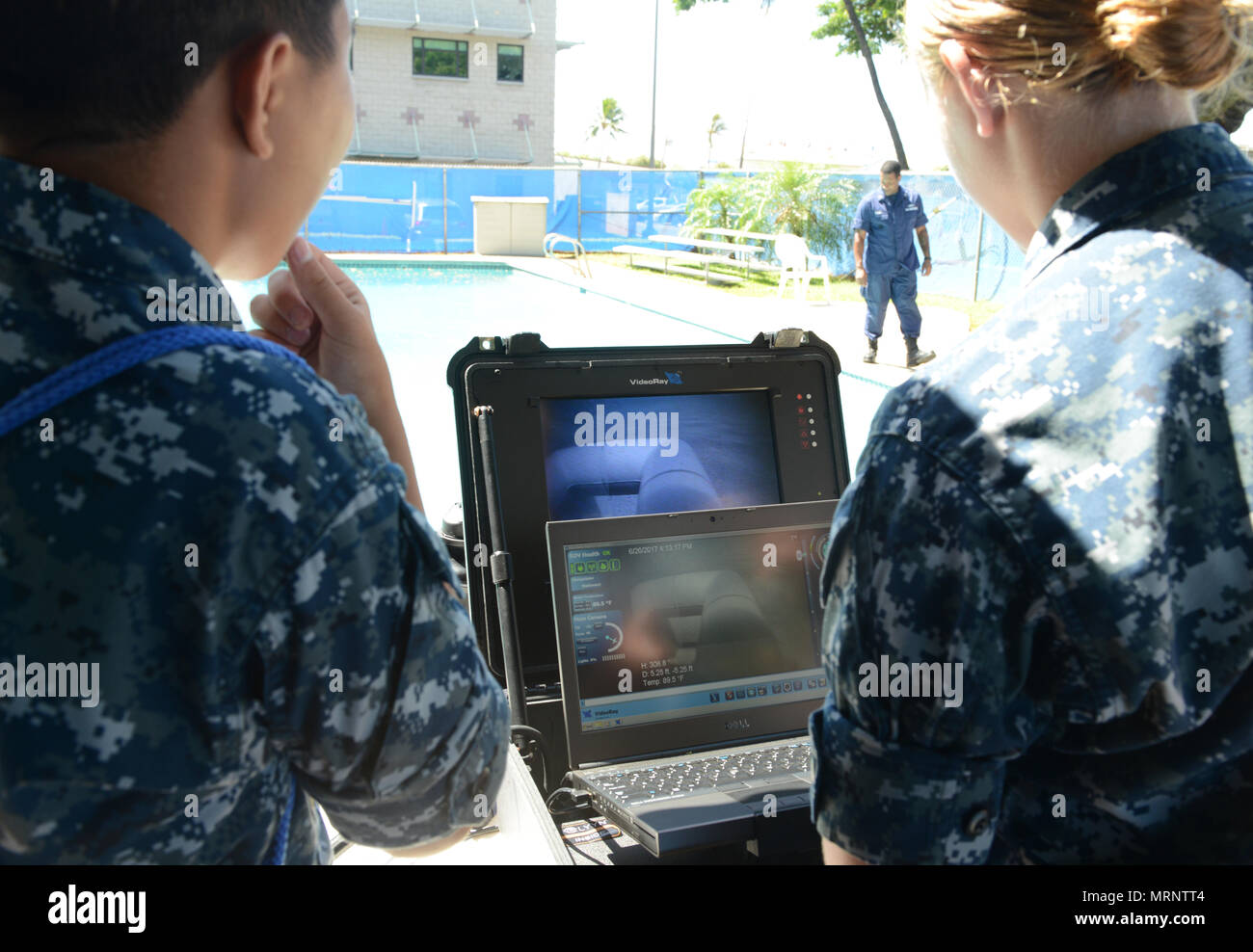 U.S. Naval Sea Cadets practice operating a remotely operated vehicle during a training evolution at Coast Guard Base Honolulu, June 26, 2017. The U.S. Naval Sea Cadet Corps is a Navy-based organization, which serves to teach teens about sea-going military services, U.S. naval operations and training, community service, discipline and teamwork. (U.S. Coast Guard photo by Petty Officer 2nd Class Tara Molle/Released) Stock Photo