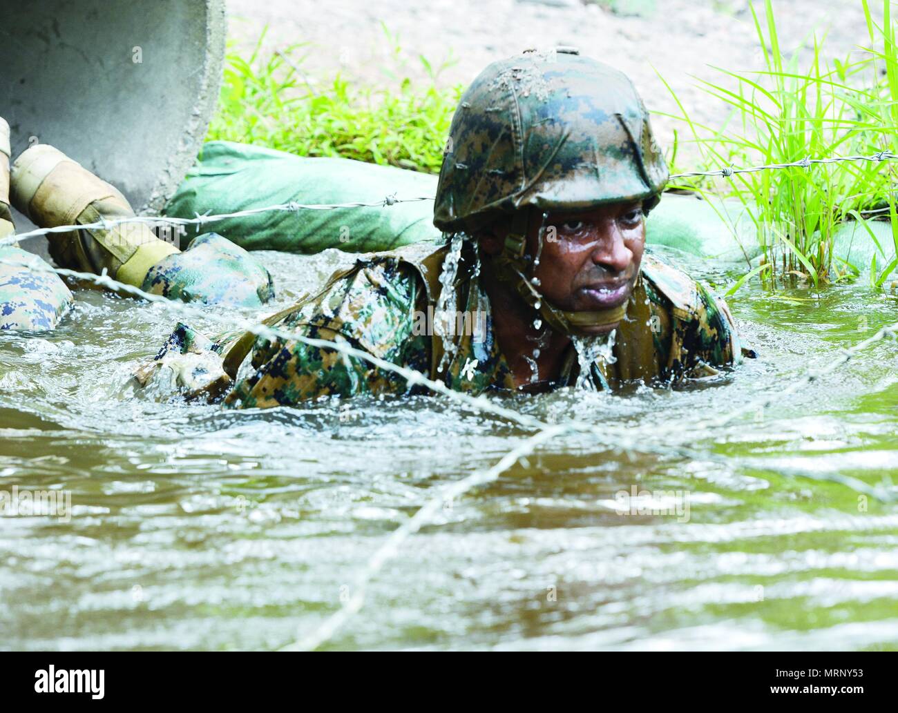 A Marine participates in doing "The Quigley" in honor of the 50th