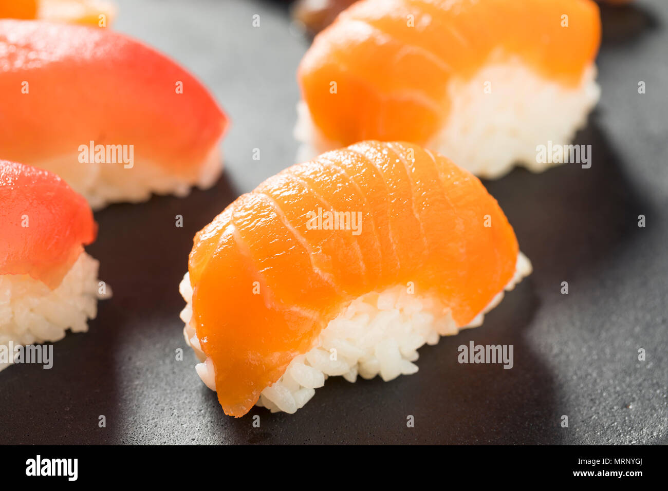 Raw Japanese Salmon Sashimi with Wasabi and Nigiri Stock Photo