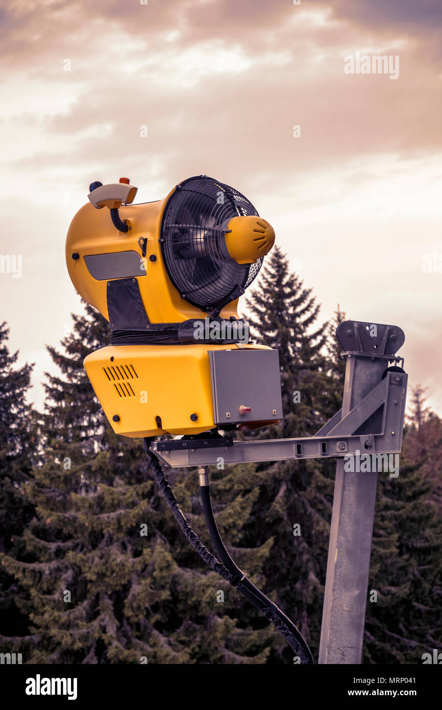 Snow machine waiting for frost with sky background, snowmaker machine ...