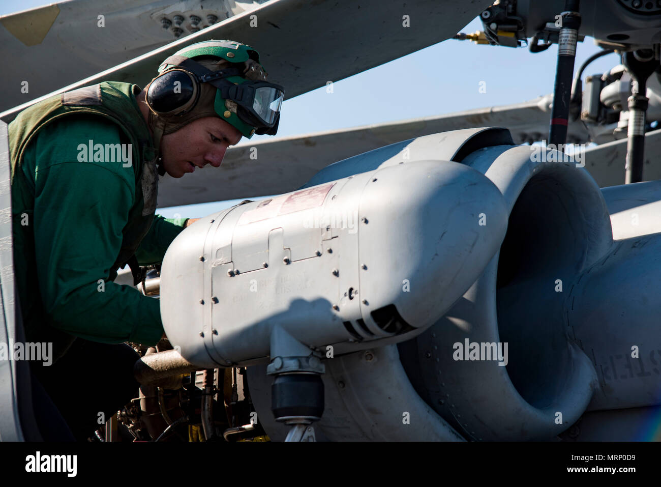 170625-N-QI061-119  ATLANTIC OCEAN (June 25, 2017) Aviation Machinist's Mate 3rd Class Jake Kelley, from Fayetteville, N.C., performs maintenance on a MH-60S Sea Hawk assigned to the Dusty Dogs of Helicopter Sea Combat Squadron (HSC) 7 on the flight deck aboard the aircraft carrier USS Dwight D. Eisenhower (CVN 69) (Ike). Ike is underway during the sustainment phase of the Optimized Fleet Response Plan (OFRP). (U.S. Navy photo by Mass Communication Specialist 3rd Class Nathan T. Beard) Stock Photo