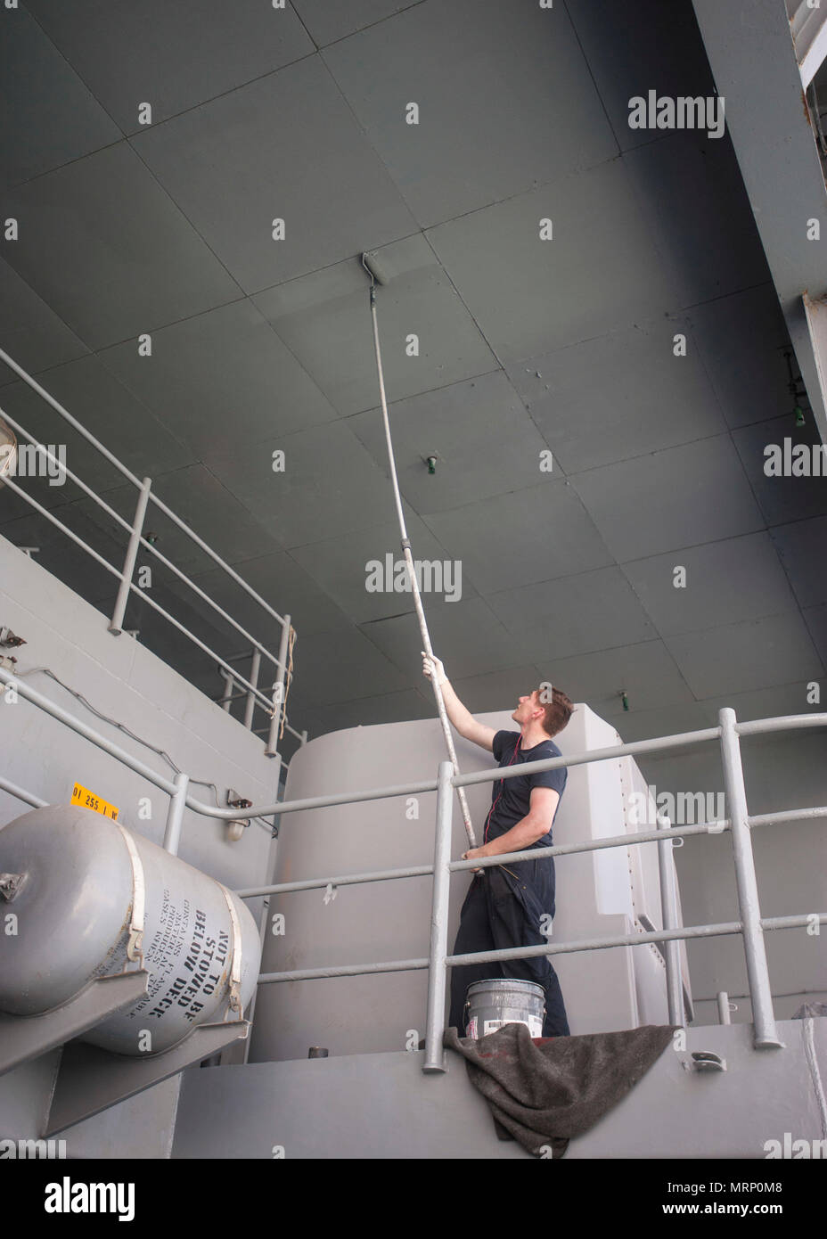 170626-N-ME396-266 MEDITERRANEAN SEA (June 26, 2017) Seaman Robert Mucka repaints the overhead on the fantail of the aircraft carrier USS George H.W. Bush (CVN 77) (GHWB). GHWB, part of the George H.W. Bush Carrier Strike Group (GHWBCSG), is conducting naval operations in the U.S. 6th Fleet area of operations in support of U.S. national security interests in Europe and Africa. (U.S. Navy photo by Mass Communication Specialist 3rd Class Tristan B. Lotz/Released) Stock Photo