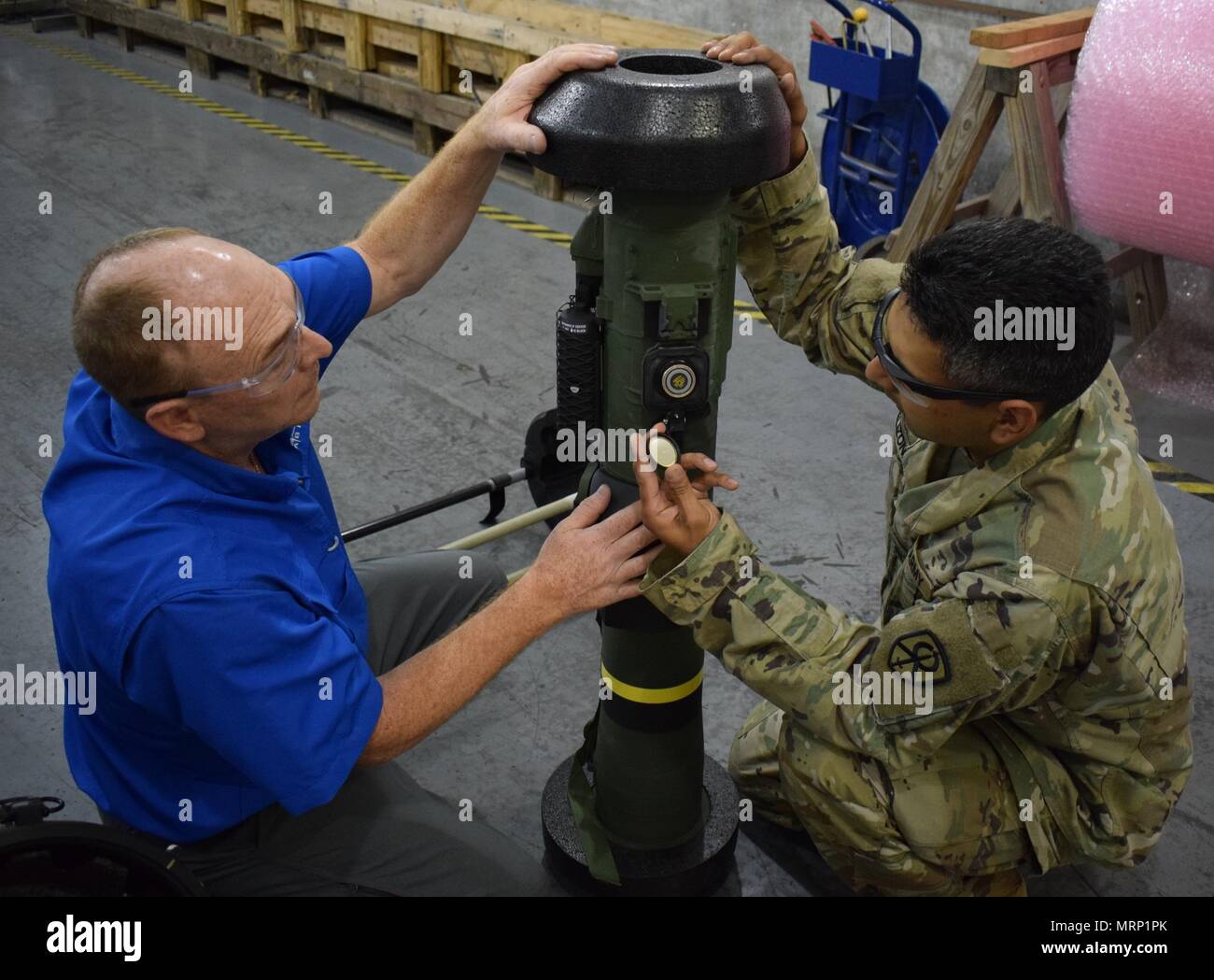 U.S. Army Reservists from the 295th Ordnance Company out of Hastings, Nebraska work with Army Civilians while completing their annual training at Crane Army Ammunition Activity. The Soldiers are receiving valuable experience handling munitions to increase mission readiness. Stock Photo