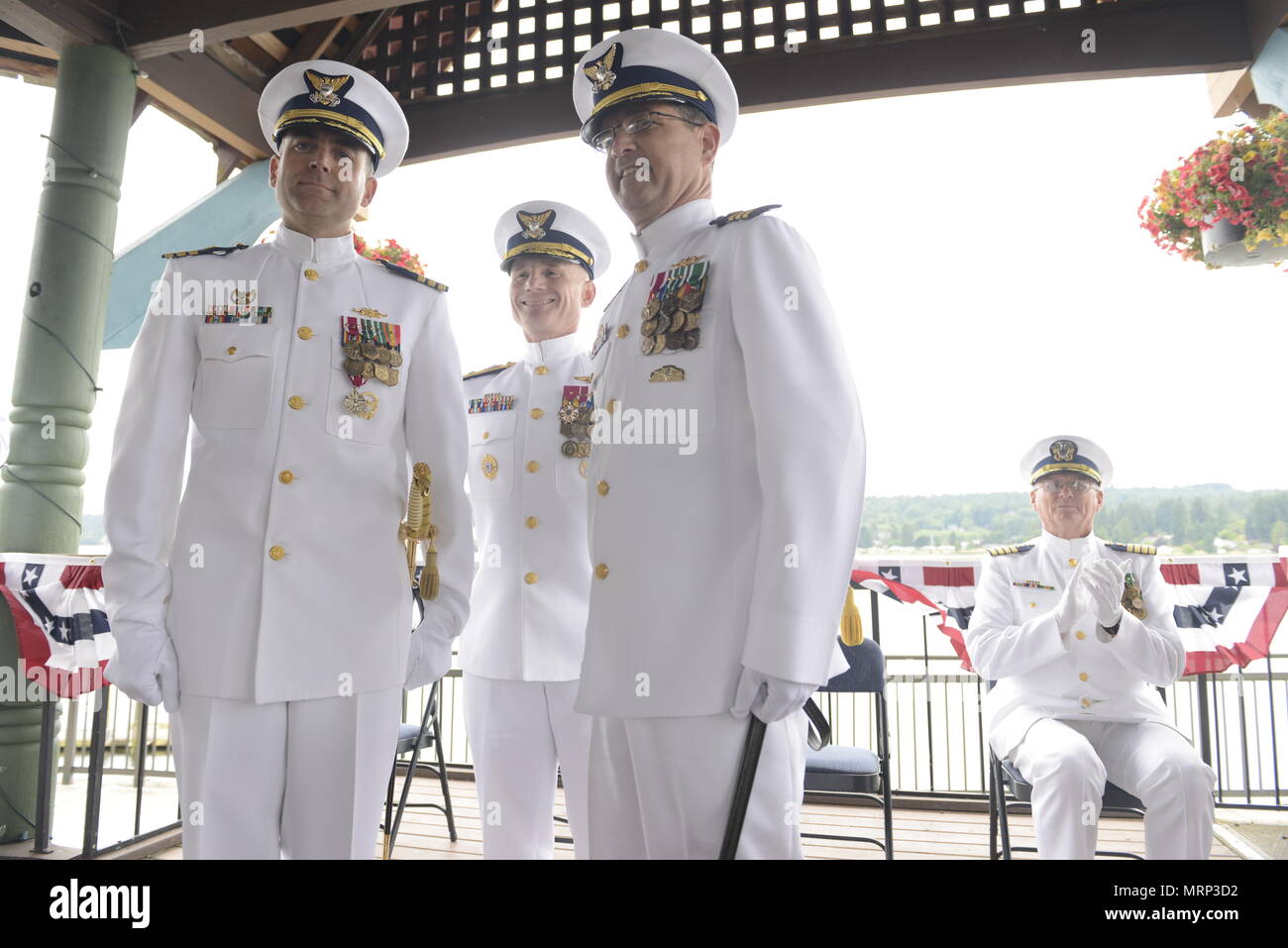 Cmdr. Michael Schoonover (left), former commanding officer of 