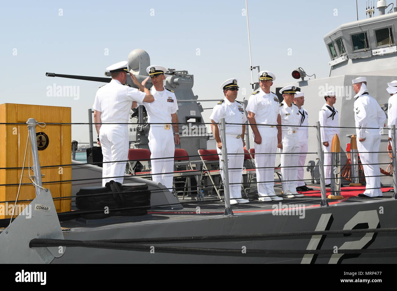 170617-N-XP344-055 MANAMA, Bahrain (June 27, 2017) From left, Lt. Cmdr. Timothy Yuhas, a native of Cave Creek, Arizona and former commanding officer of the Cyclone-class coastal patrol ship USS Thunderbolt (PC 12), salutes Lt. Cmdr. Michael T. McArawas, a native of Erie, Pennsylvania and current commanding officer, during a change of command ceremony held shipboard while pierside at Naval Support Activity Bahrain. Thunderbolt is one of 10 PCs forward deployed to Manama, Bahrain, whose mission is coastal patrol and interdiction surveillance. (U.S. Navy photo by Mass Communication Specialist 2nd Stock Photo