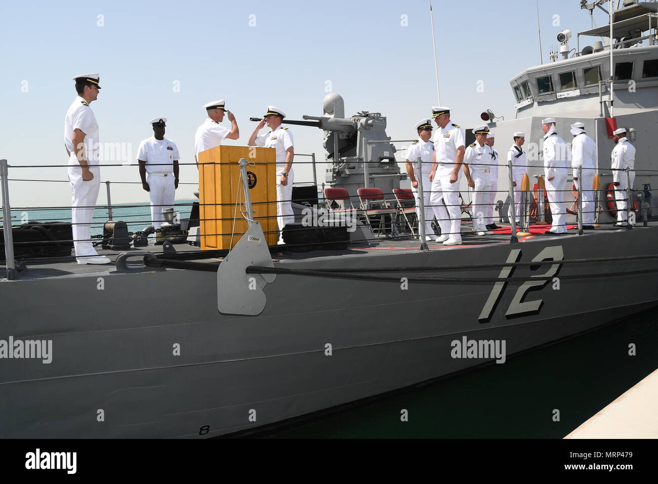 170617-N-XP344-057 MANAMA, Bahrain (June 27, 2017) From left, Lt. Cmdr. Timothy Yuhas, a native of Cave Creek, Arizona and former commanding officer of the Cyclone-class coastal patrol ship USS Thunderbolt (PC 12), salutes Lt. Cmdr. Michael T. McArawas, a native of Erie, Pennsylvania and current commanding officer, during a change of command ceremony held shipboard while pierside at Naval Support Activity Bahrain. Thunderbolt is one of 10 PCs forward deployed to Manama, Bahrain, whose mission is coastal patrol and interdiction surveillance. (U.S. Navy photo by Mass Communication Specialist 2nd Stock Photo