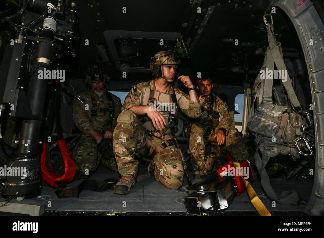 U.S. Air Force Airmen from the New Jersey Air National Guard's 227th Air Support Operations Squadron prepare to lift off in a UH-60 Black Hawk helicopter during joint training for New Jersey Task Force One at Joint Base McGuire-Dix-Lakehurst, N.J., June 28, 2017. The primary mission of New Jersey Task Force One is to provide advanced technical search and rescue capabilities to victims trapped or entombed in structurally collapsed buildings. Task Force One is made up of New Jersey National Guard Soldiers and Airmen, as well as civilians. (U.S. Air National Guard photo by Master Sgt. Matt Hecht/ Stock Photo