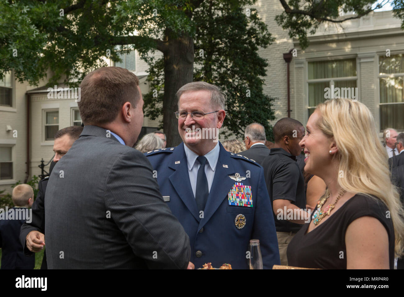 U.S. Air Force Lt. Gen. Thomas J. Trask, vice commander of Headquarters U.S. Special Operations Command (SOCOM), speaks with guests during a reception before an evening parade at Marine Barracks Washington, Washington, D.C., June 23, 2017. Evening parades are held as a means of honoring senior officials, distinguished citizens and supporters of the Marine Corps. (U.S. Marine Corps photo by Lance Cpl. Stephon L. McRae) Stock Photo