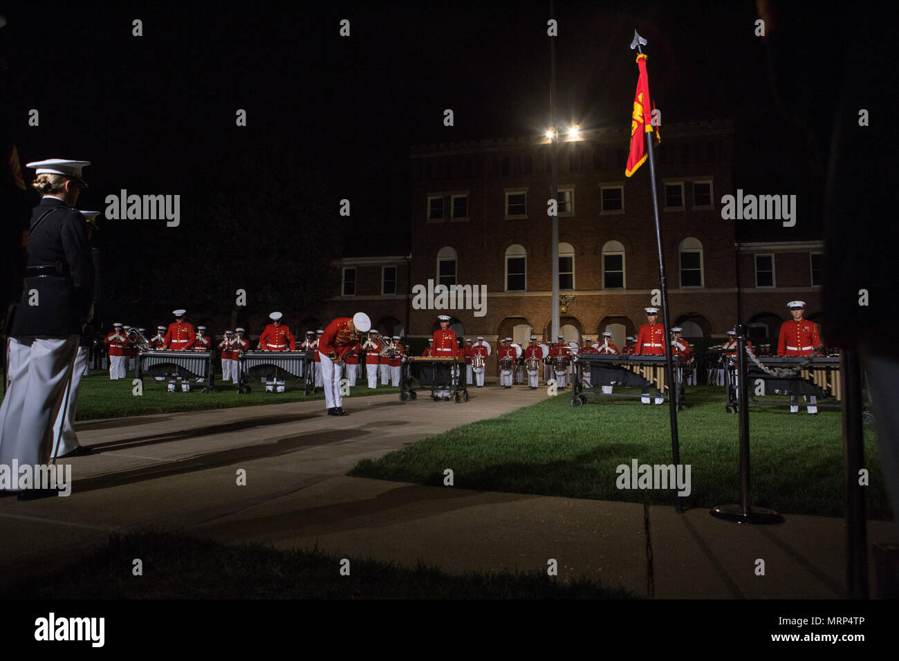 U.S. Marines with the U.S. Marine Drum and Bugle Corps perform during an evening parade at Marine Barracks Washington, Washington, D.C., June 9, 2017. Evening parades are held as a means of honoring senior officials, distinguished citizens and supporters of the Marine Corps. (U.S. Marine Corps photo by Lance Cpl. Stephon L. McRae) Stock Photo