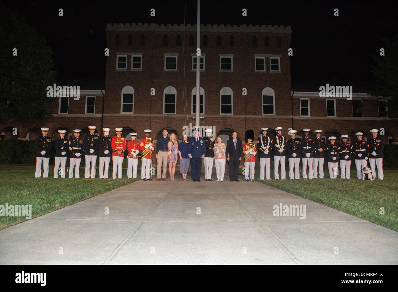 U.S. Air Force Lt. Gen. Thomas J. Trask, vice commander of Headquarters U.S. Special Operations Command (SOCOM) and Director Marine Corps Staff Lt. Gen. James B. Laster, pose for a group photo with Marines and civilians during an evening parade at Marine Barracks Washington, Washington, D.C., June 23, 2017. Evening parades are held as a means of honoring senior officials, distinguished citizens and supporters of the Marine Corps. (U.S. Marine Corps photo by Lance Cpl. Stephon L. McRae) Stock Photo