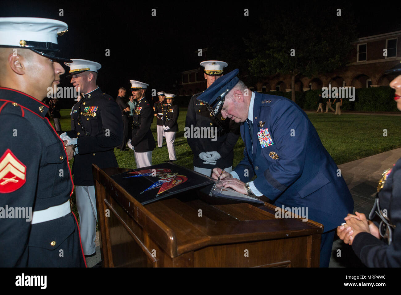 U.S. Air Force Lt. Gen. Thomas J. Trask, vice commander of Headquarters U.S. Special Operations Command (SOCOM), signs a guest book after an evening parade at Marine Barracks Washington, Washington, D.C., June 23, 2017. Evening parades are held as a means of honoring senior officials, distinguished citizens and supporters of the Marine Corps. (U.S. Marine Corps photo by Lance Cpl. Stephon L. McRae) Stock Photo