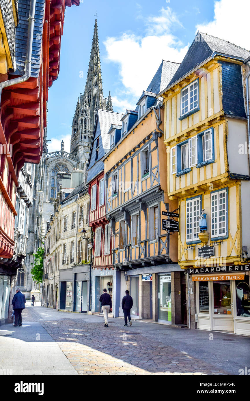 Pastel half-timbered buildings and a cathedral jutting into the sky are amongst the sights on a quiet Sunday stroll in Quimper, Brittany, France. Stock Photo
