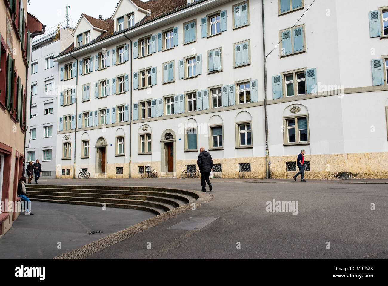 People walking in Utengasse in Basel old town (Altstadt Kleinbasel) among traditional Swiss medieval houses. Switzerland. Stock Photo