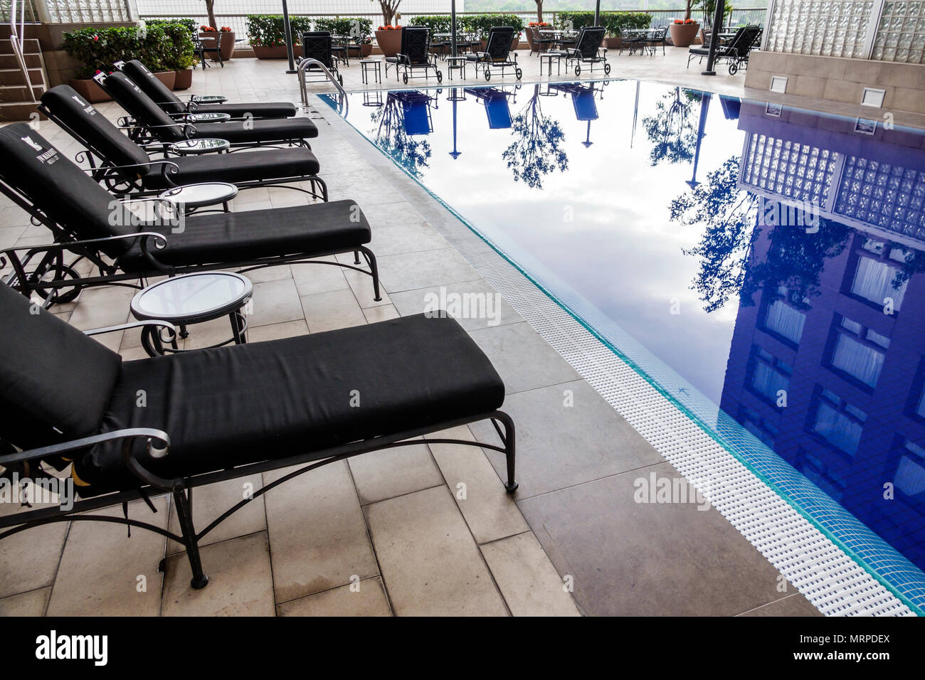 Mexico City,Polanco,Hispanic,immigrant immigrants,Mexican,JW Marriott,hotel,pool deck,water reflection,lounge chairs MX180309116 Stock Photo