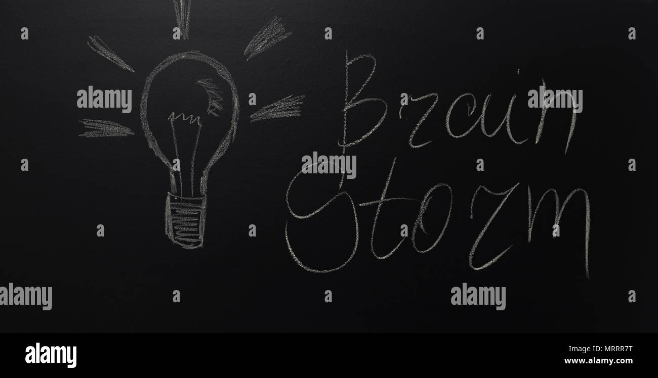drawn light on blackboard with the text: Brain Storm Stock Photo