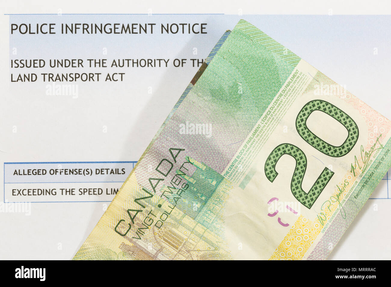 Canadian Money Piled On A Traffic Infringement Notice Stock Photo Alamy