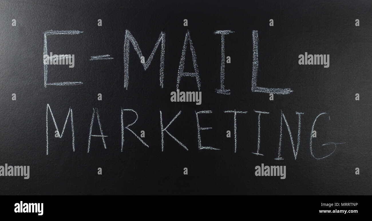 written with a text: E-mail marketing on blackboard Stock Photo