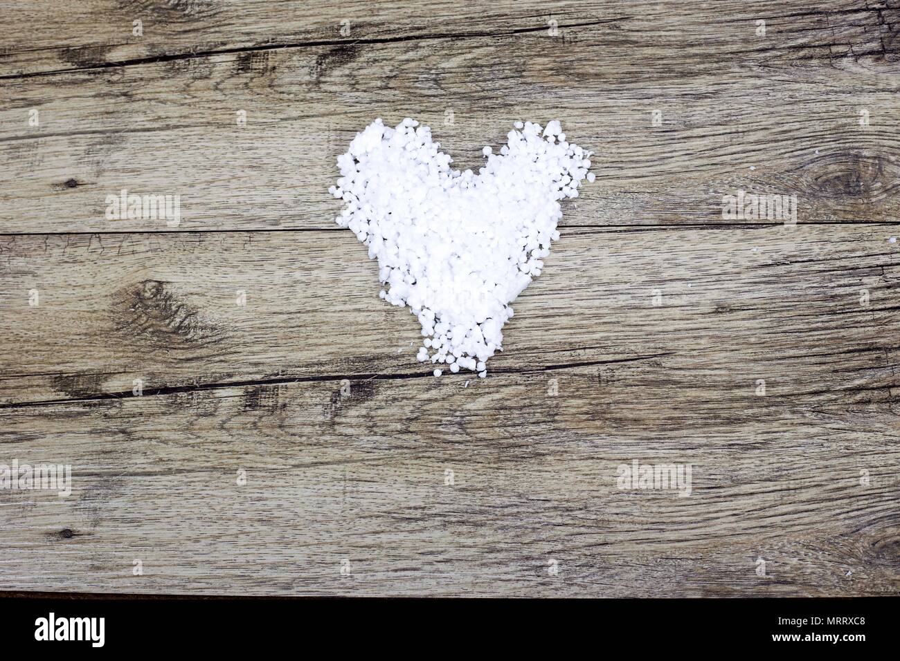 White heart made from polystyrene balls on background Stock Photo