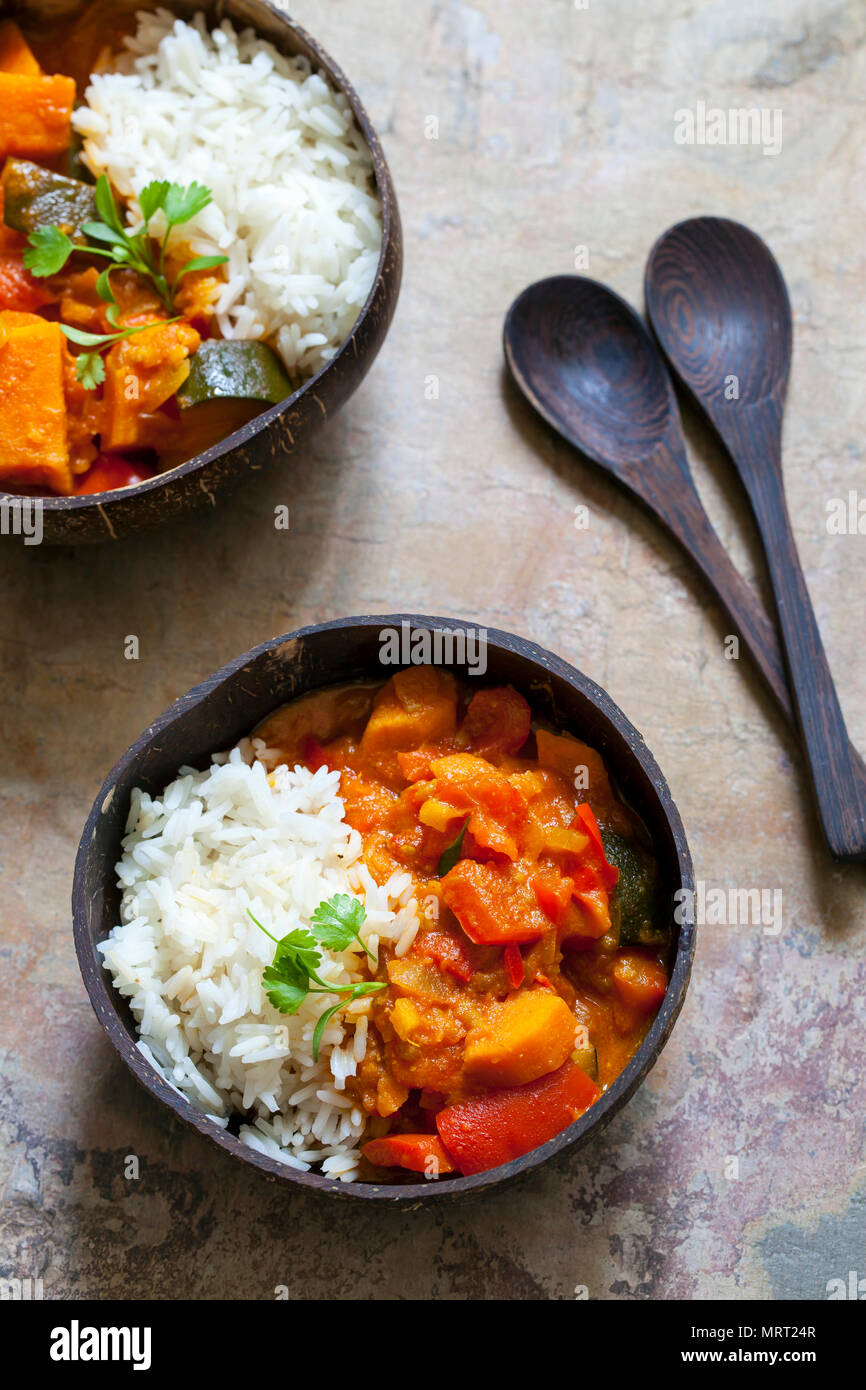Sweet potato, courgette and red pepper vegan curry with rice and micro