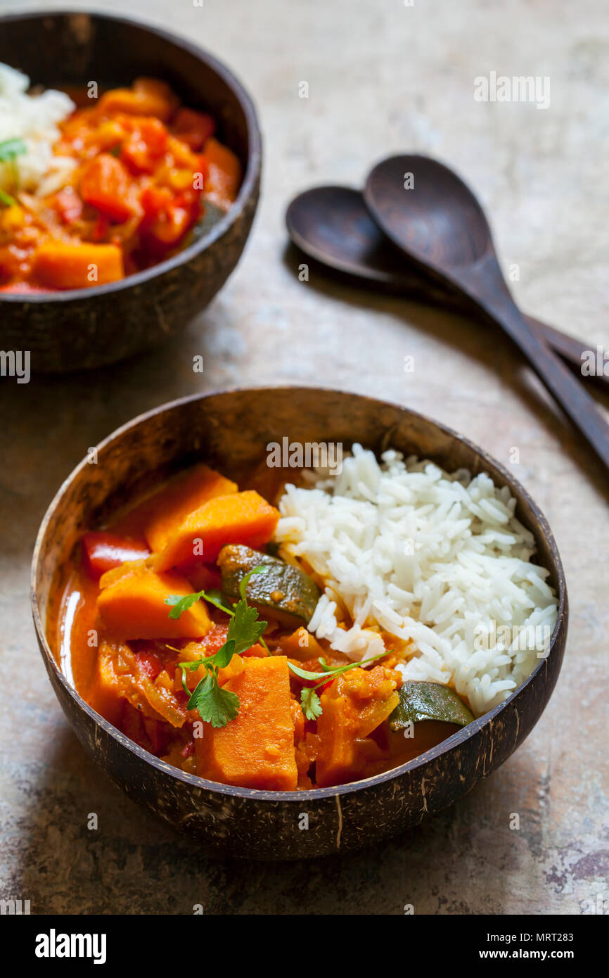Sweet potato, courgette and red pepper vegan curry with rice and micro