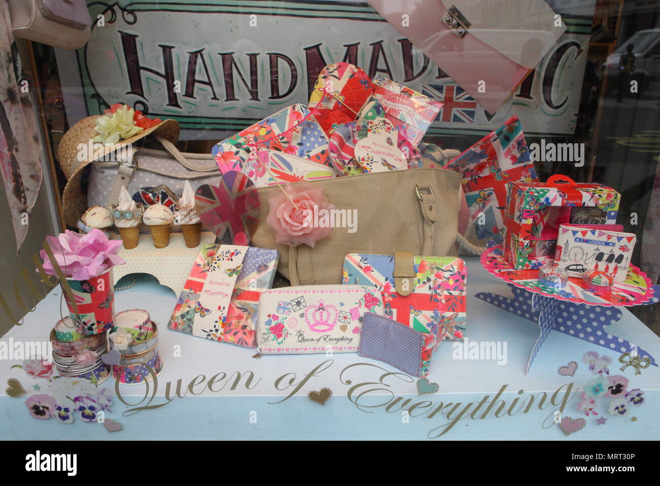 In celebration of the forthcoming Diamond Jubilee, Union Jack flags and bunting flutter above the streets and shop windows display crowns and flag motifs with the Royal theme, London. 1 June 2012 --- Image by © Paul Cunningham Stock Photo