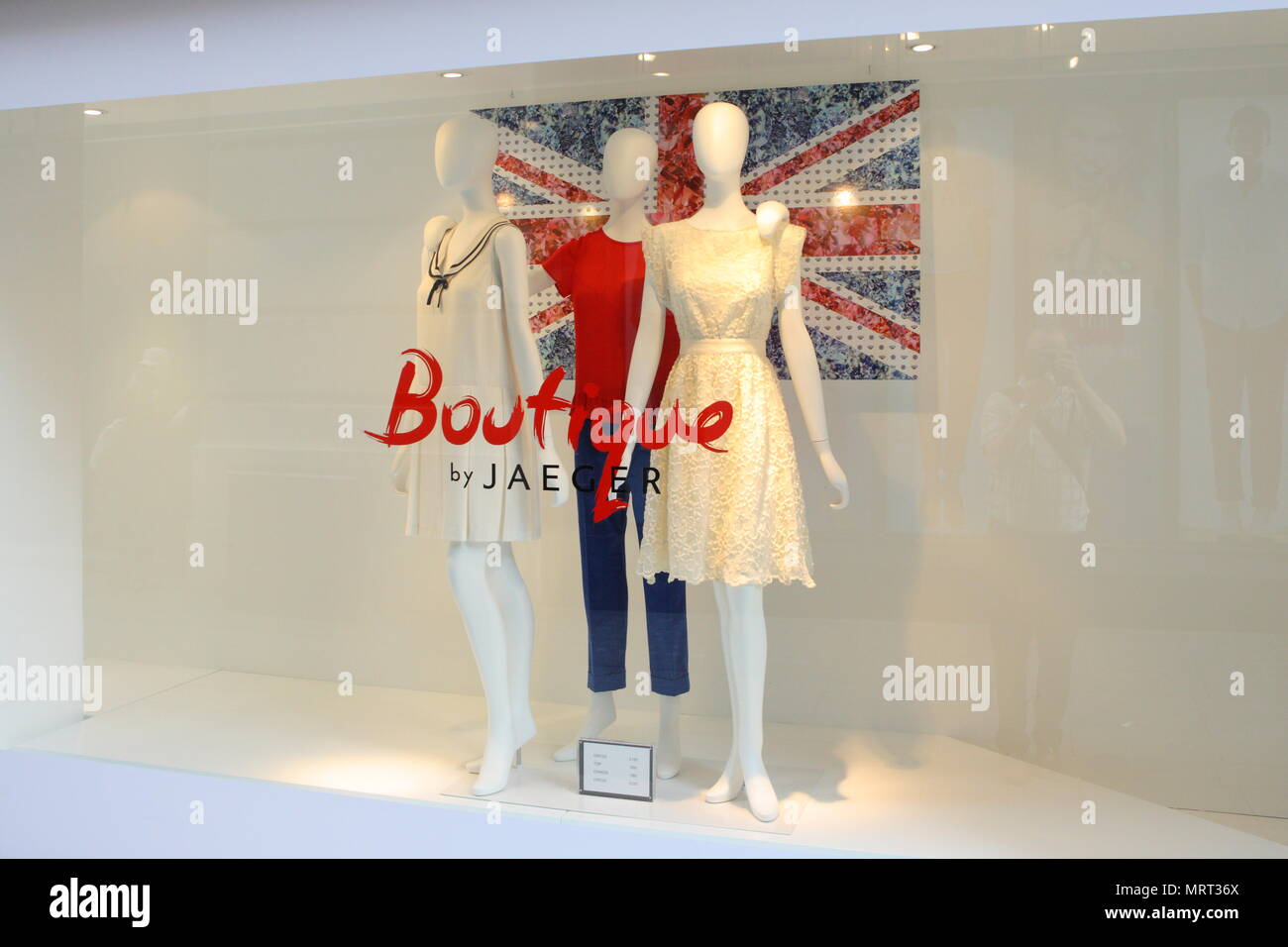 In celebration of the forthcoming Diamond Jubilee, Union Jack flags and bunting flutter above the streets and shop windows display crowns and flag motifs with the Royal theme, London. 1 June 2012 --- Image by © Paul Cunningham Stock Photo