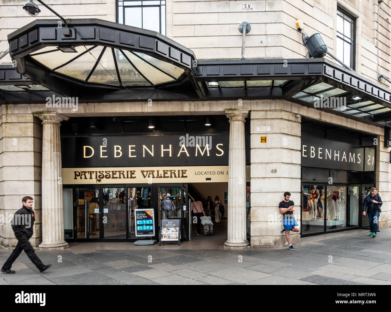 Exterior and main entrance of the Debenhams store in Argyle Street, Glasgow, Scotland, with a sign for Patisserie Valerie inside the shop. Stock Photo