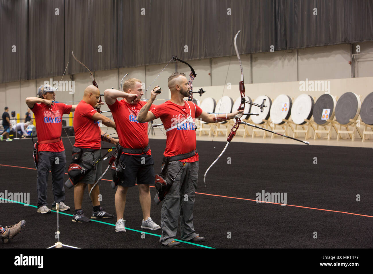 2017 DoD Warrior Games Team Marine Corps archers send arrows downrange during a Warrior Games practice at McCormick Place in Chicago, June 29, 2017. The Warrior Games is an adaptive sports competition for wounded, ill and injured service members and veterans. (U.S. Marine Corps photo by Lance Cpl. Nadia J. Stark) Stock Photo