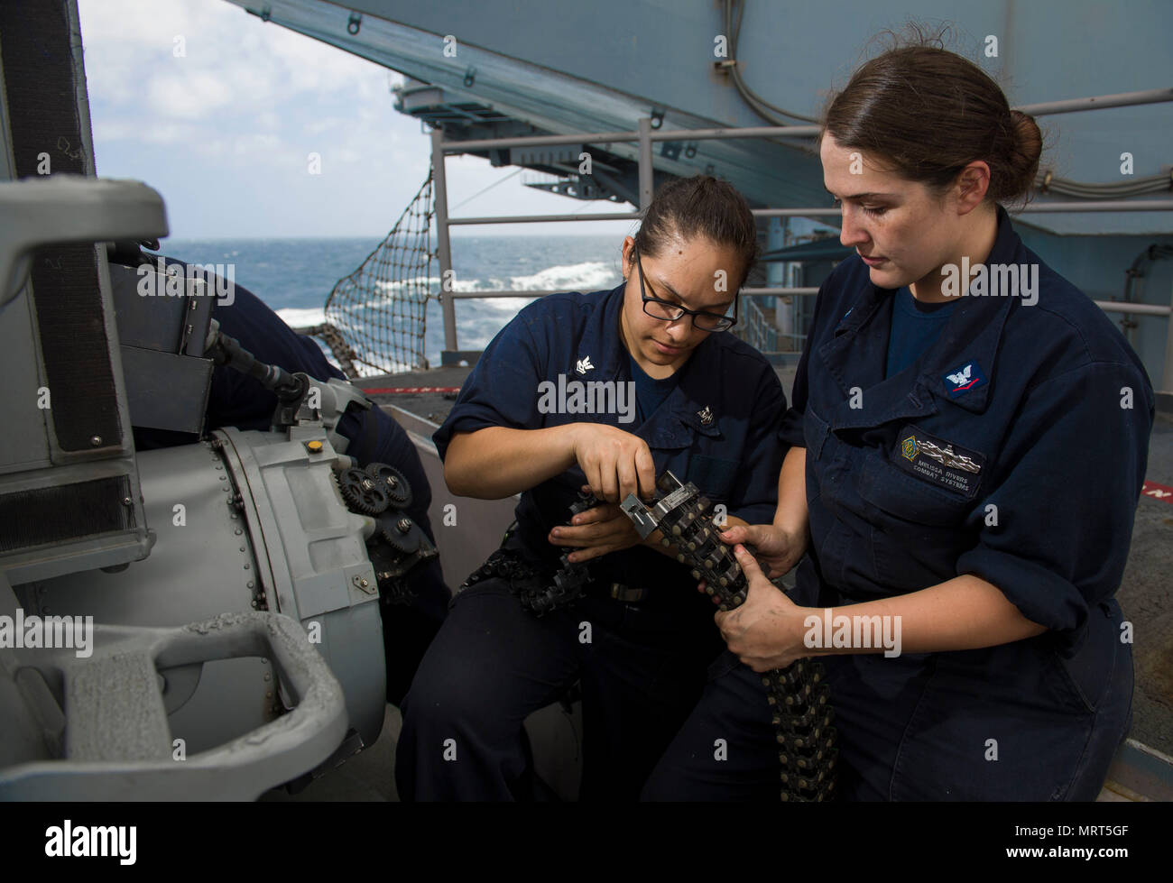170624-N-TJ319-036  ATLANTIC OCEAN (June 24, 2017) Fire Controlman 2nd Class Harley Foskett, from San Antonio, Texas., and Fire Controlman 3rd Class Melissa Rivers, from Hot Springs, Ark., perform maintenance on a phalanx close-in weapon system aboard the aircraft carrier USS Dwight D. Eisenhower (CVN 69)(Ike). Ike is underway during the sustainment phase of the Optimized Fleet Response Plan (OFRP). (U.S. Navy photo by Mass Communication Specialist Seaman Jessica L. Dowell) Stock Photo