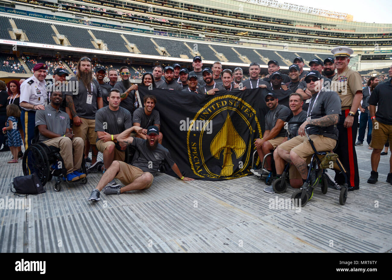Team SOCOM pose for a picture with Lt. Gen. Joseph Osterman, (far right) deputy commander USSOCOM, at the opening ceremony for the 2017 Warrior Games on Soldier Field in Chicago, Ill., July 1, 2017. The Warrior Games were established in 2010 as a way to enhance the recovery and rehabilitation of wounded warriors and to expose them to adaptive sports. Photo by Michael Bottoms, USSOCOM Office of Communication. Stock Photo