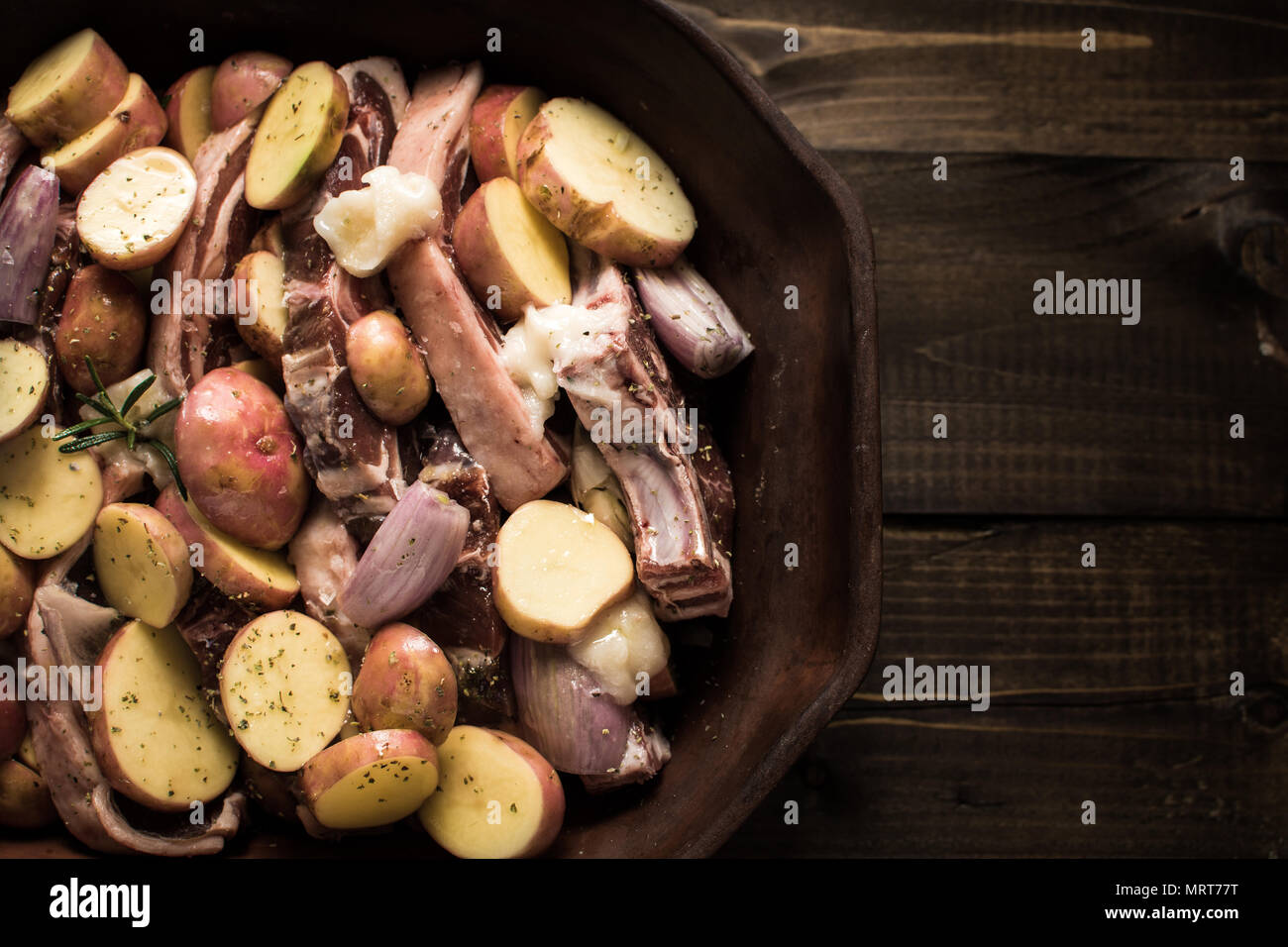 Lamb Loin Chops and Vegetables Prepared for Roasting. Copy Space Stock