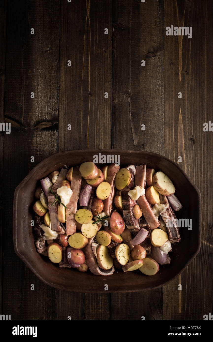 Lamb Loin Chops and Vegetables Prepared for Roasting. Copy Space Stock