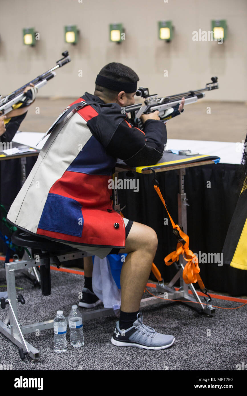 U.S. Army Staff Sgt. Marcus E. Menchaca, stationed at Fort Sam Houston,  Texas, takes aim with his air rifle during the shooting competition for the  2017 Department of Defense Warrior Games at