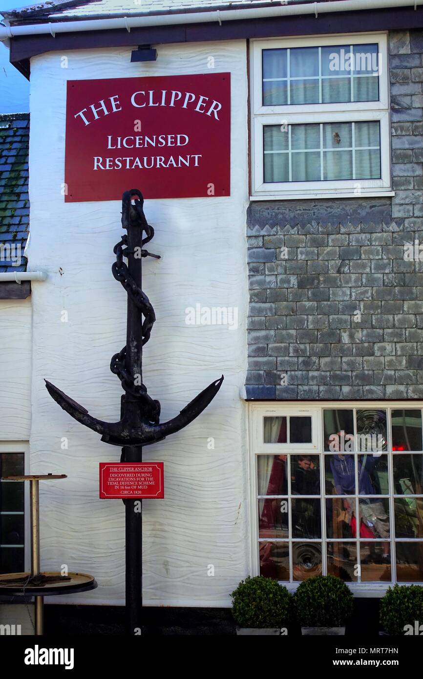 Padstow, Cornwall, April 11th 2018: Large old anchor on the wall of The Clipper pub and restaurant in the Cornish fishing village of Padstow Stock Photo