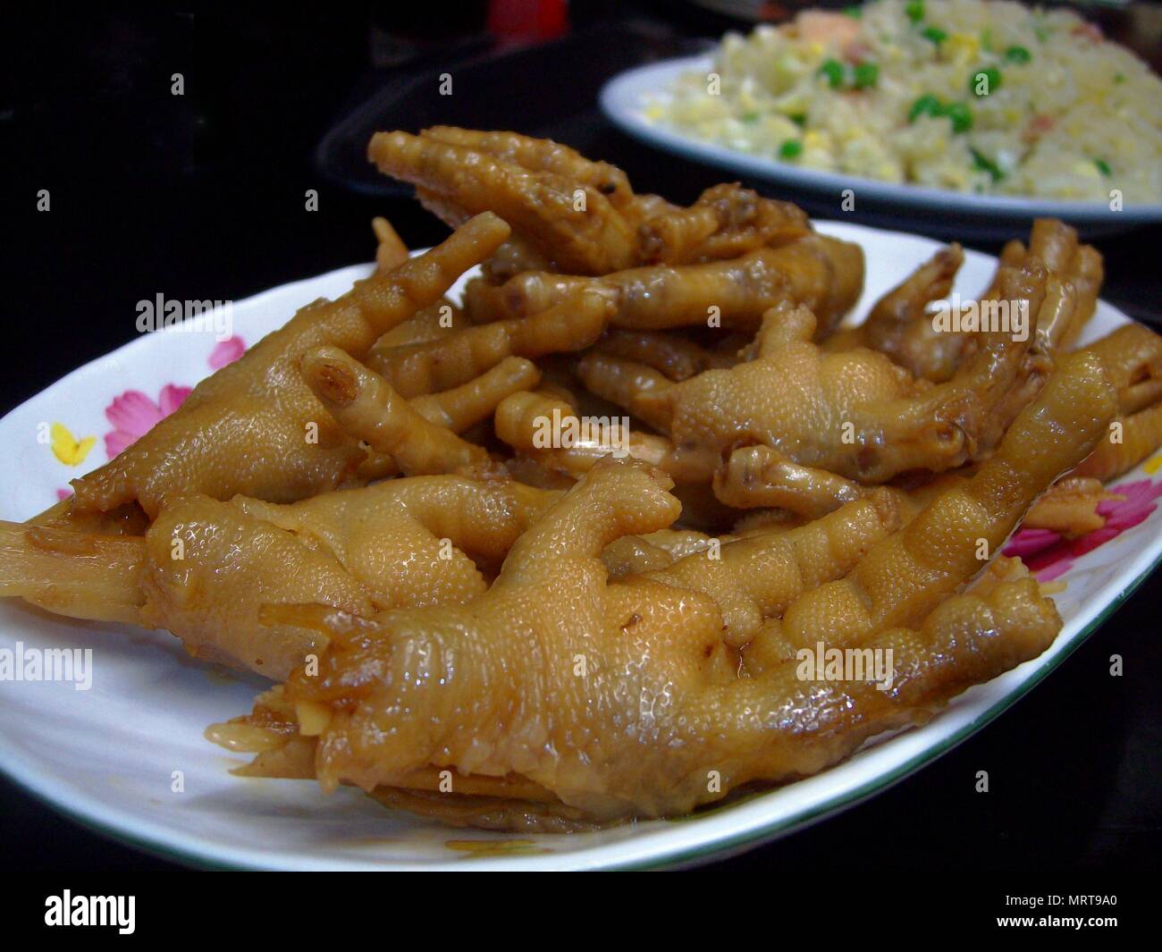 Chicken feet, called “adidas” in street lingo is a top popular street food  in the Philippines Stock Photo - Alamy