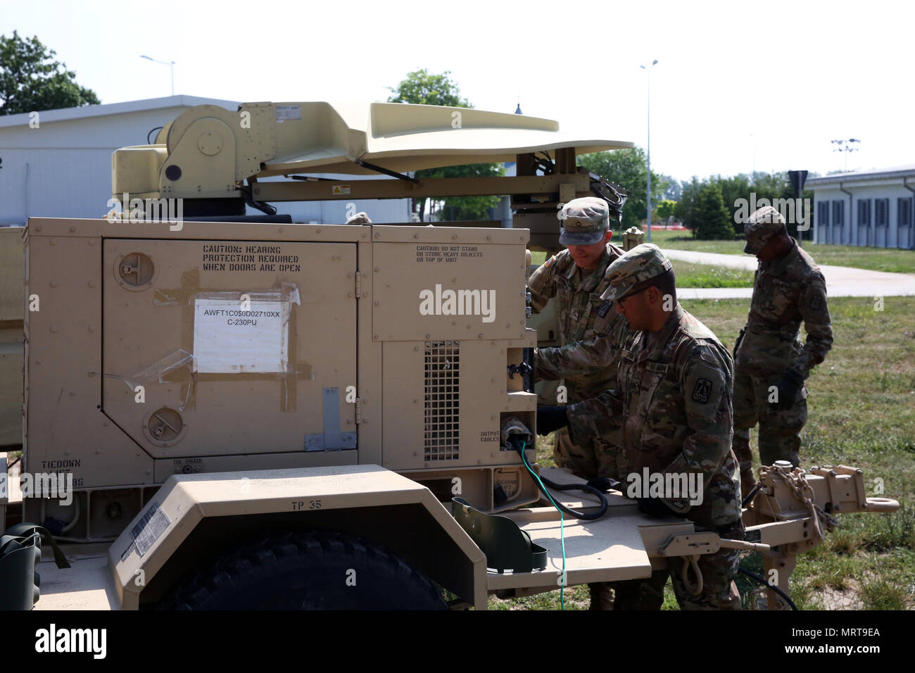 U.S. Army Soldiers assigned to Charlie Company, 86th Expeditionary Signal Battalion, 11th Signal Brigade, set up a generator and Satellite Transportable Terminal June 29, 2017 at Mihail Kogalniceanu Air Base, Romania. The 86th Expeditionary Signal Bn. from Fort Bliss, Texas is augmenting 2nd Theater Signal Brigade with additional tactical signal assets and capability for exercise Saber Guardian 17, a U.S. Army Europe-led, multinational exercise, taking place in Bulgaria, Hungary and Romania July 11-20, 2017. (U.S. Army photo by William B. King) Stock Photo