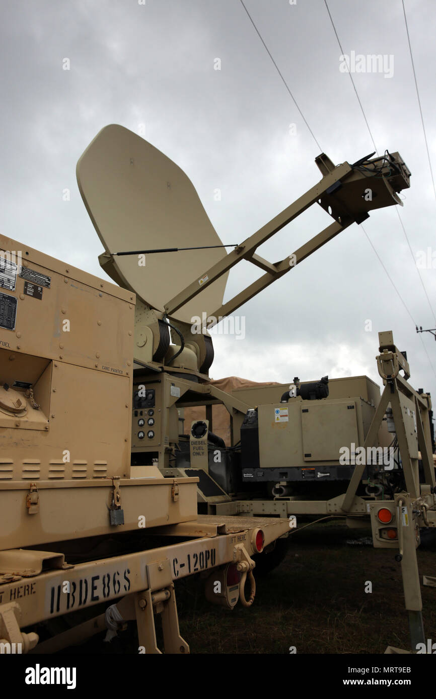 A Satellite Transportable Terminal from the 86th Expeditionary Signal Battalion, 11th Signal Brigade, setting up to provide communications support to the 30th Medical Brigade in Cincu, Romania, July 3, 2017. The 86th Expeditionary Signal Bn. from Fort Bliss, Texas is augmenting 2nd Theater Signal Brigade with additional tactical signal assets and capability for exercise Saber Guardian 17, a U.S. Army Europe-led, multinational exercise, taking place in Bulgaria, Hungary and Romania July 11-20, 2017.  (U.S. Army photo by William B. King) Stock Photo