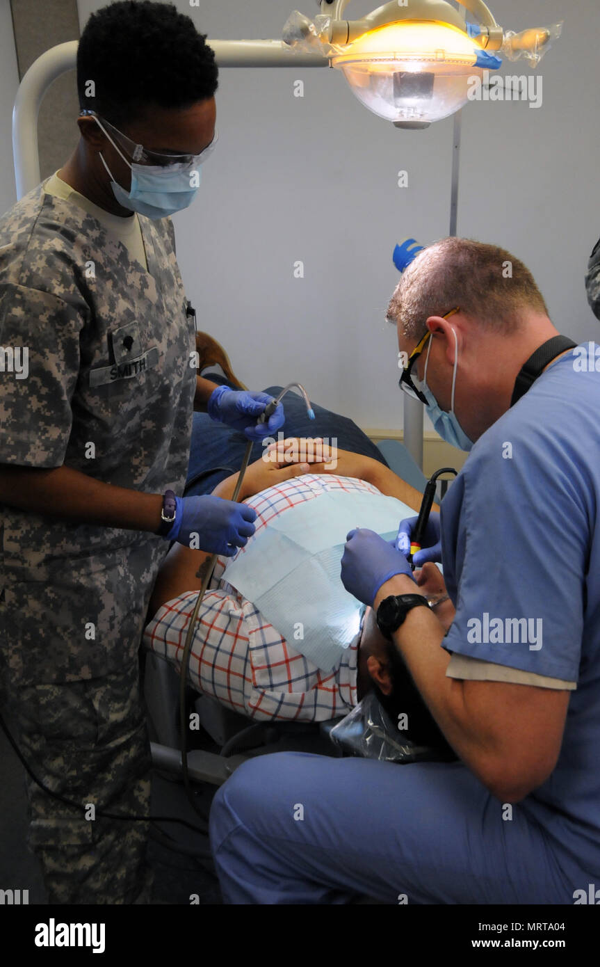 Maj. Matthew Morris, a dentist, and Spc. Chatel Smith, a dental