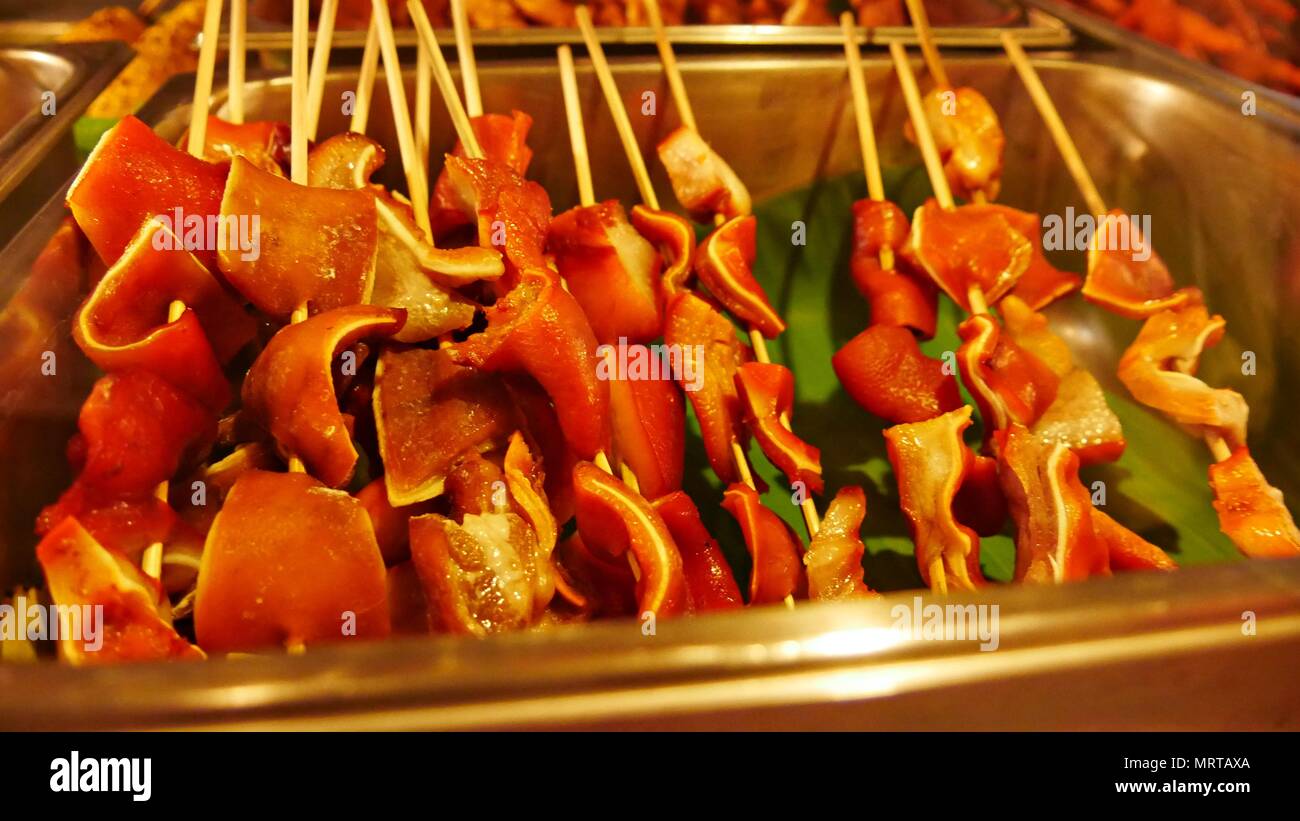 Pork ears barbequed in a skewer is a very popular street food in the