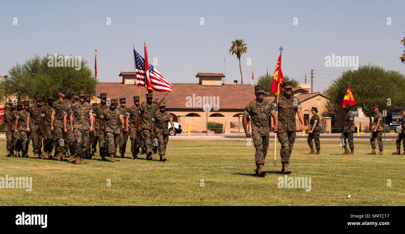 U.S. Marines with Marine Corps Air Station (MCAS) Yuma, Ariz., Headquarters and Headquarters Squadron conduct a pass in review during Sgt. Maj. Delvin R. Smythe's, the MCAS Yuma sergeant major, retirement ceremony, June 30, 2017. (U.S. Marine Corps photo taken by Lance Cpl. Christian Cachola) Stock Photo