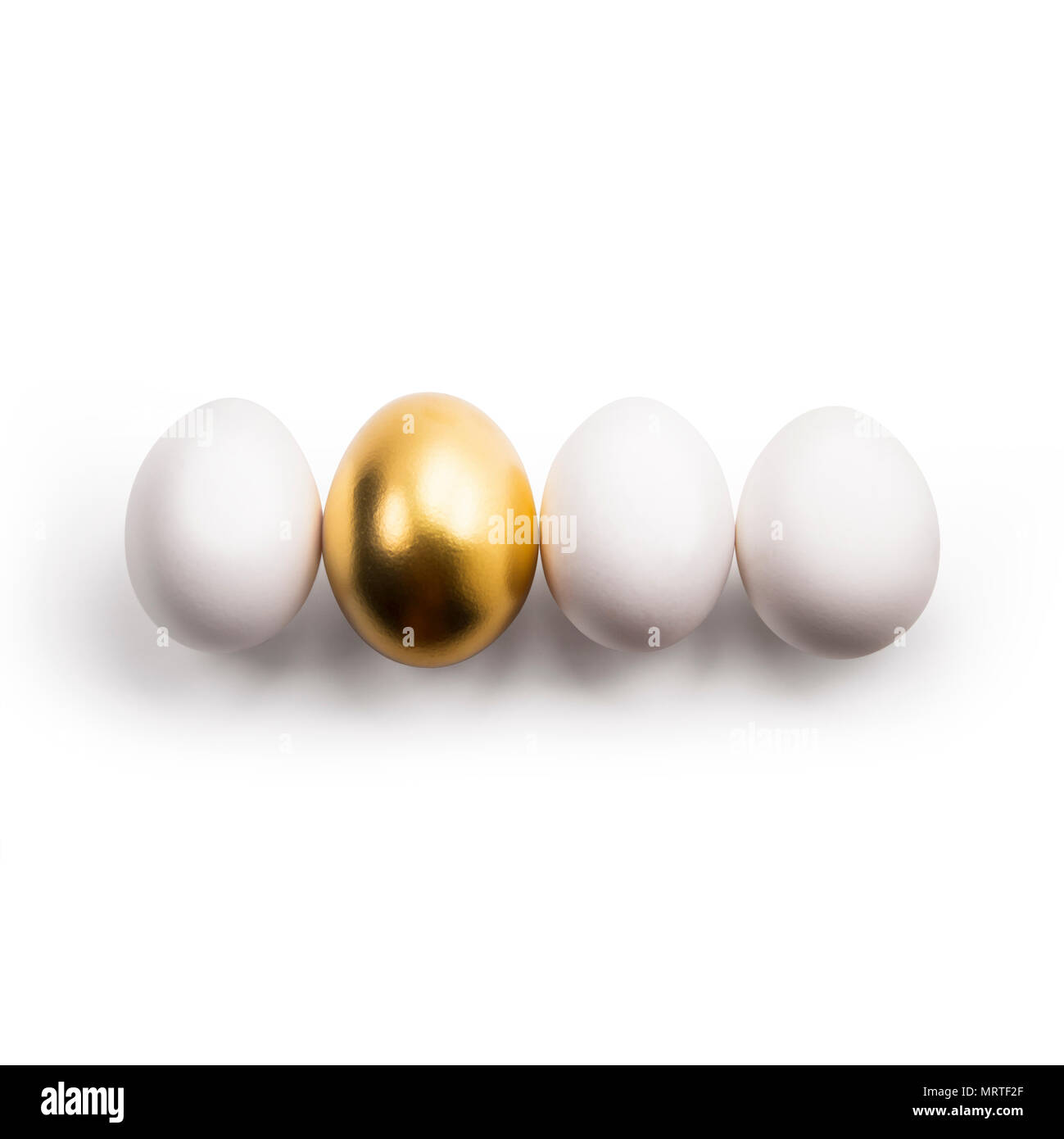 white eggs and Golden egg Stock Photo Alamy