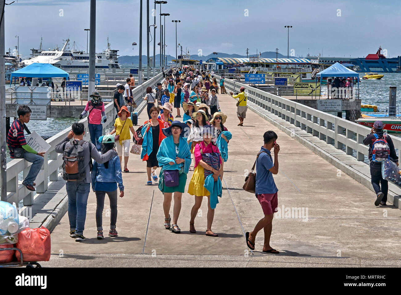 Thailand Tourists returning from a boat trip and arriving at Bali Hai pier Pattaya Thailand Southeast Asia Stock Photo