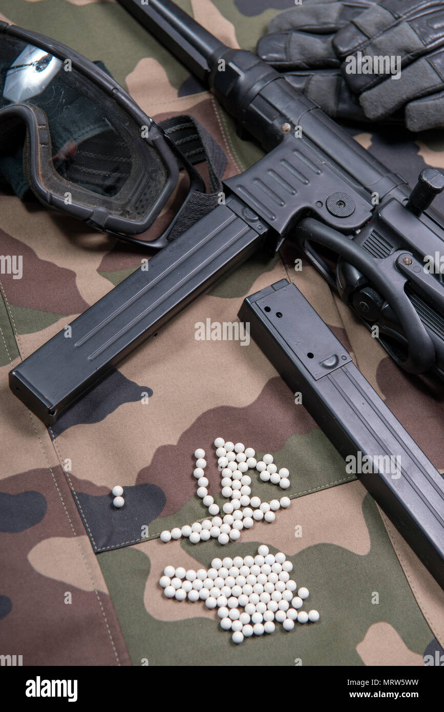 air soft gun with protective glasses and a lot of bullets Stock Photo -  Alamy