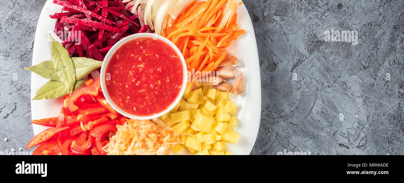 Vegetables, beets, carrots, potatoes, sweet peppers, onion, garlic, sauerkraut, tomato sauce, bay leaf, salt, pepper, peas - ingredients preparation o Stock Photo