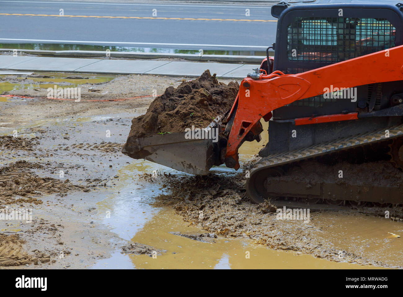 Bucket wheeled loader on the construction. Closeup of the bucket. Side