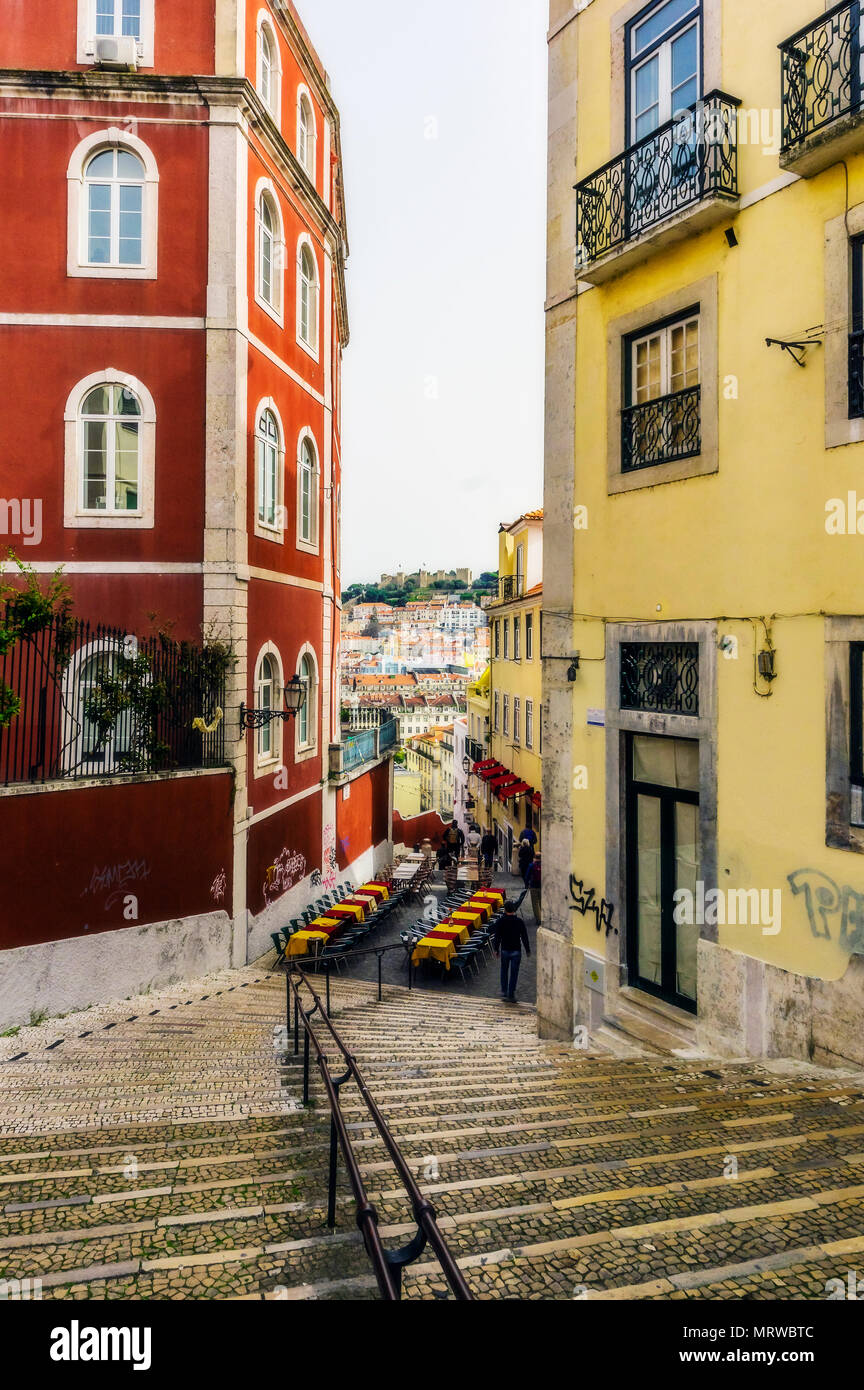 Staircase and alley through historic colorful houses, Lisbon, Portugal