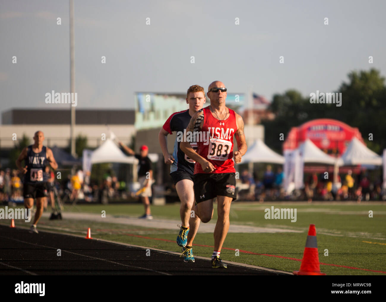 U.S. Marine Corps Sgt. Maj. Brian Fogarty, a member of Team Marine Corps and native of New Philadelphia, Pa., takes the lead in a men’s 1,500-meter race during the 2017 DoD Warrior Games Track Competition at Lane Technical College Preparatory High School in Chicago July 2, 2017.  The DoD Warrior Games is an adaptive sports competition for wounded, ill and injured service members and veterans. (U.S. Marine Corps photo by Lance Cpl. Nadia J. Stark) Stock Photo