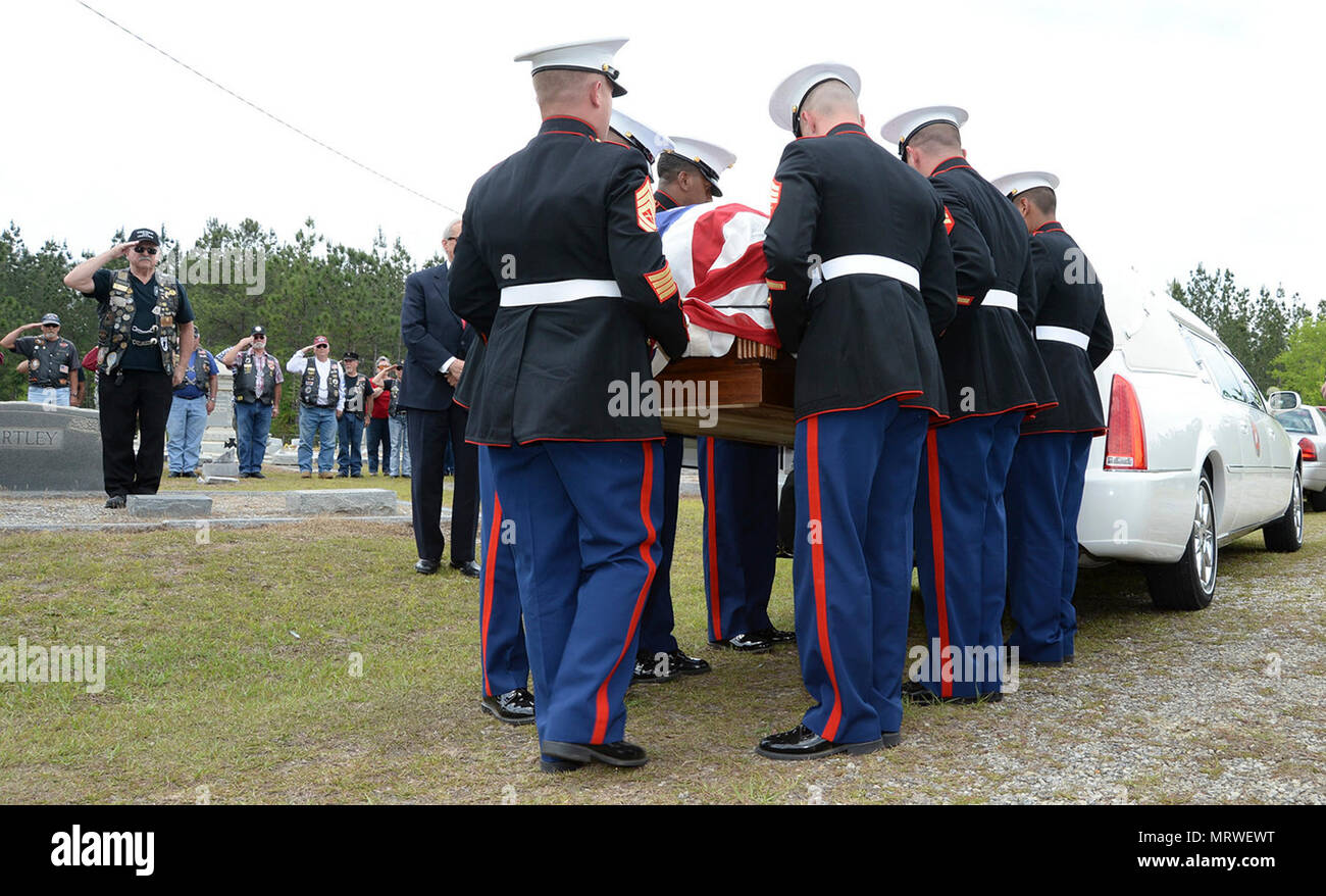 Gunnery Sgt. Melvin G. Ashley (center) escort, and Marines with Marine