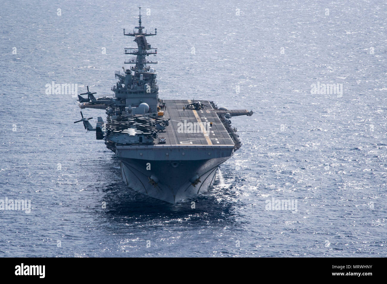 170709-N-WF272-923 CORAL SEA (July 9, 2017) The amphibious assault ship USS Bonhomme Richard (LHD 6) conducts flight operations as the Bonhomme Richard Expeditionary Strike Group (BHR ESG) transits the Coral Sea during Talisman Saber 17. Bonhomme Richard, part of a combined U.S.-Australia-New Zealand expeditionary strike group, is undergoing a series of scenarios that will increase naval proficiencies in operating against blue-water adversarial threats and in its primary mission of launching Marine forces ashore in the littorals. Talisman Saber is a biennial U.S.-Australia bilateral exercise h Stock Photo