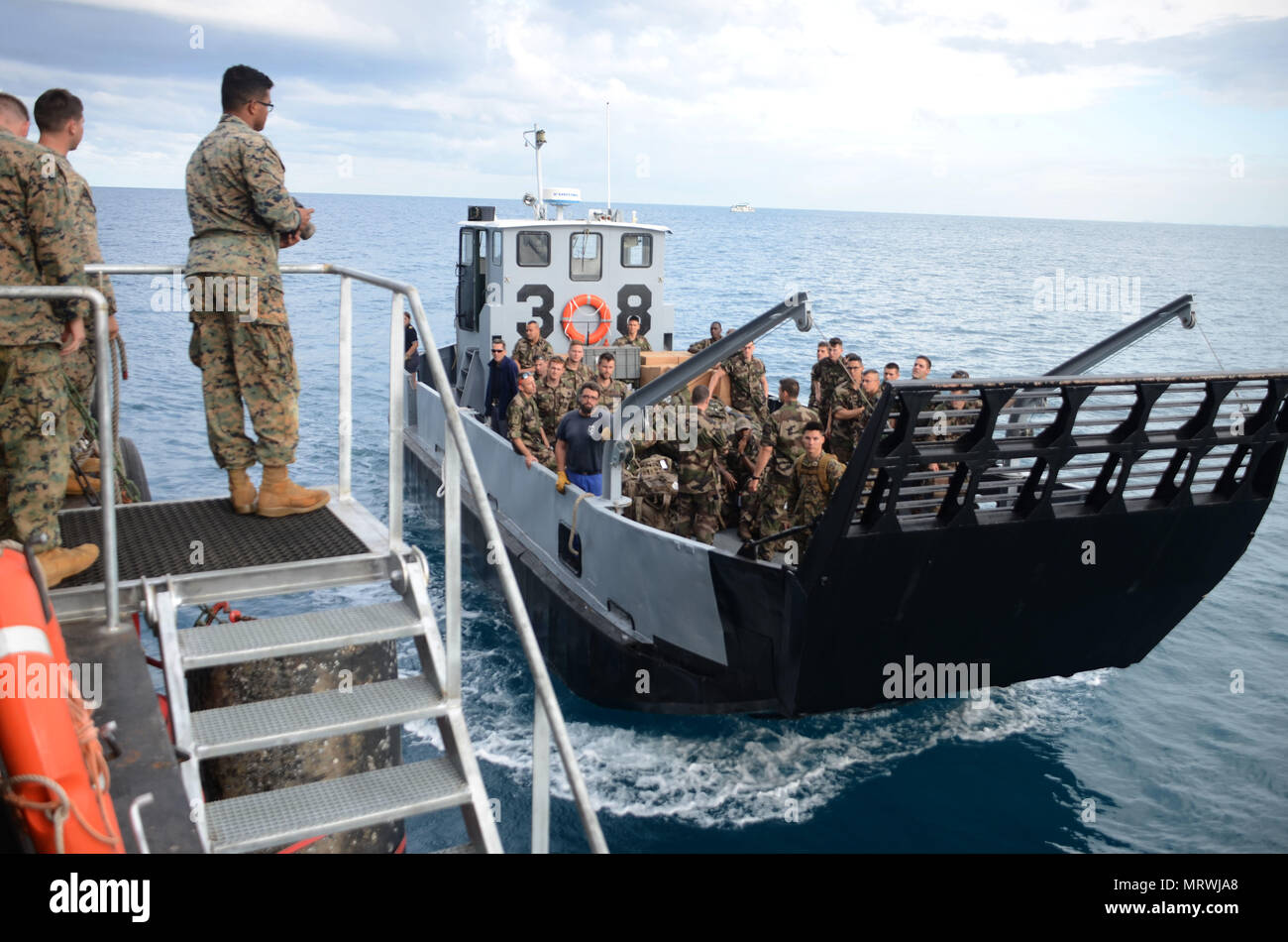 170710-N-WJ640-035 NOUMEA, New Caledonia (July 10, 2017) French Armed Forces New Caledonia prepare to board USNS Sacagawea (T-AKE 2) to transit with embarked U.S. Marines for a field exercise in Nuku'alofa, Tonga during Koa Moana 17, July 10. Koa Moana 17 is designed to improve theater security, and conduct law enforcement and infantry training in the Pacific region in order to enhance interoperability with partner nations. (U.S. Navy photo by Mass Communication Specialist 3rd Class Madailein Abbott) Stock Photo